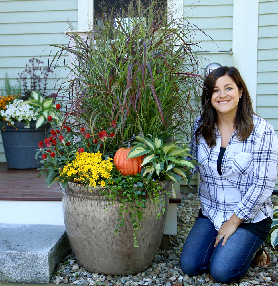 Laura from Garden Answer next to a fall planter