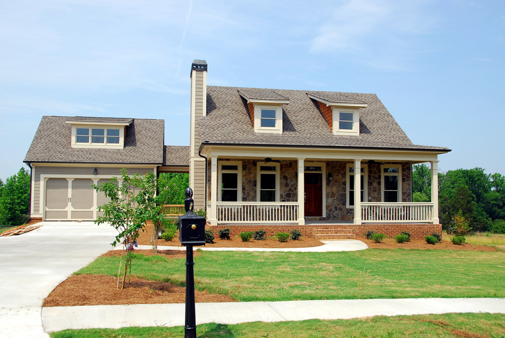 House with newly planted landscape